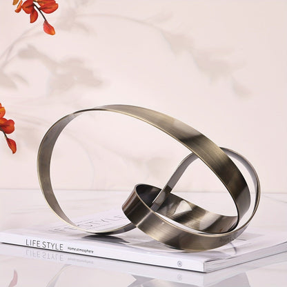 Escultura Moderna Abstrata em Metal -Nó Infinity Loja da Dryka 
